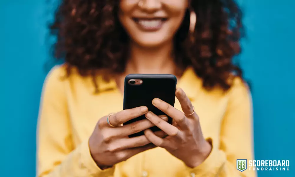 3 Woman holding a cell phone.
